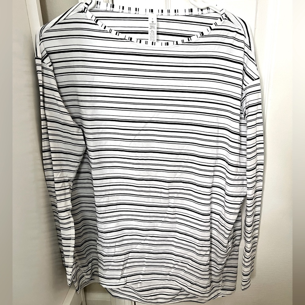 Lululemon- new without tags- back in action long sleeve- size 6